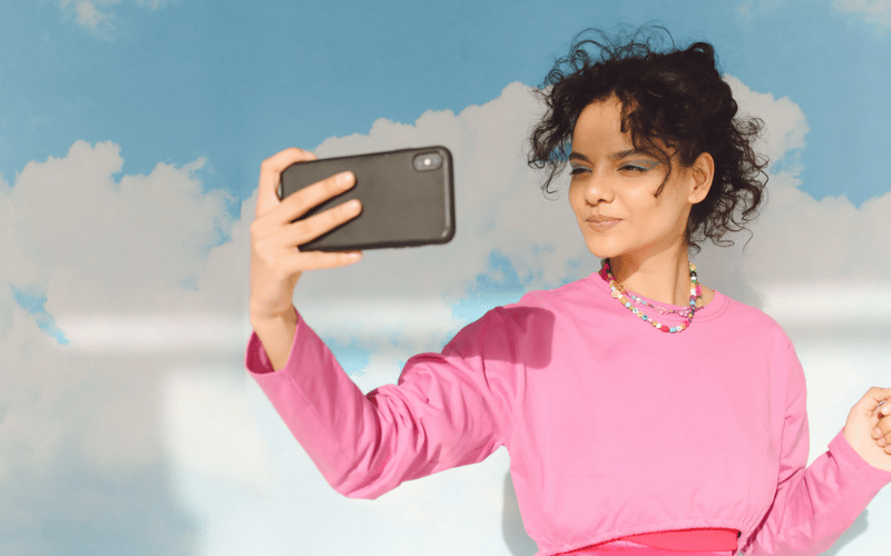Make your brand stand out - woman taking a professional selfie